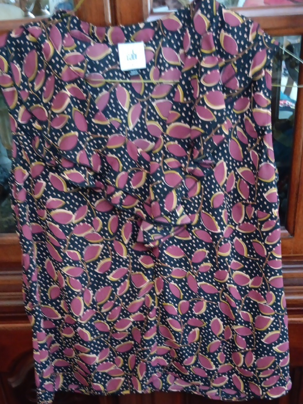 CAbi Black Sleeveless Top with Pink and Mustard Leaf Print